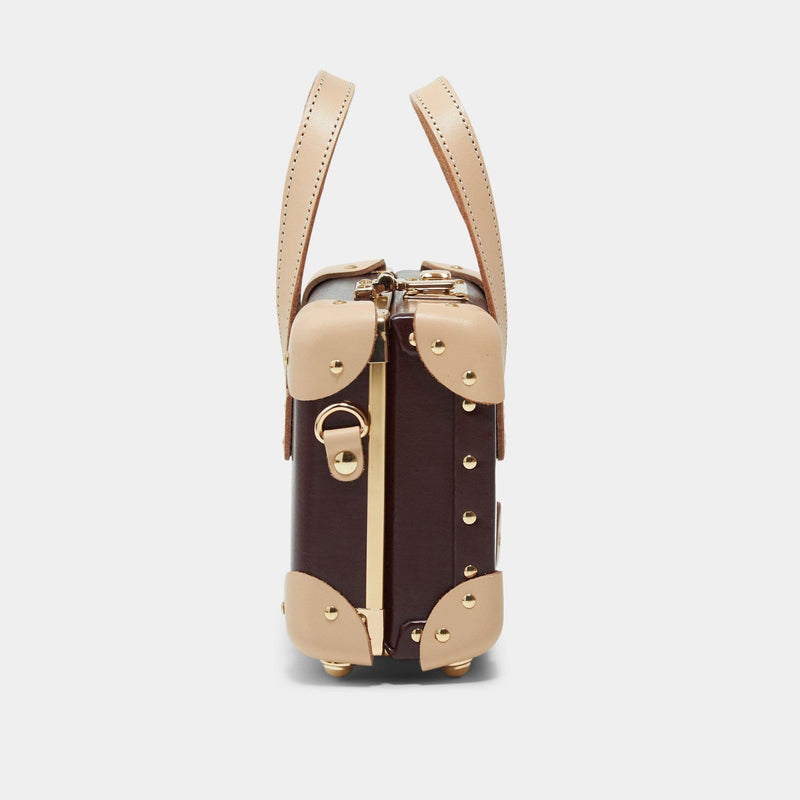Side product view of the mini Architect leather handbag in burgundy