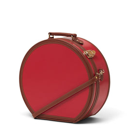 Angled product view of the large hatbox Diplomat leather suitcase in red with shoulder attachment strap