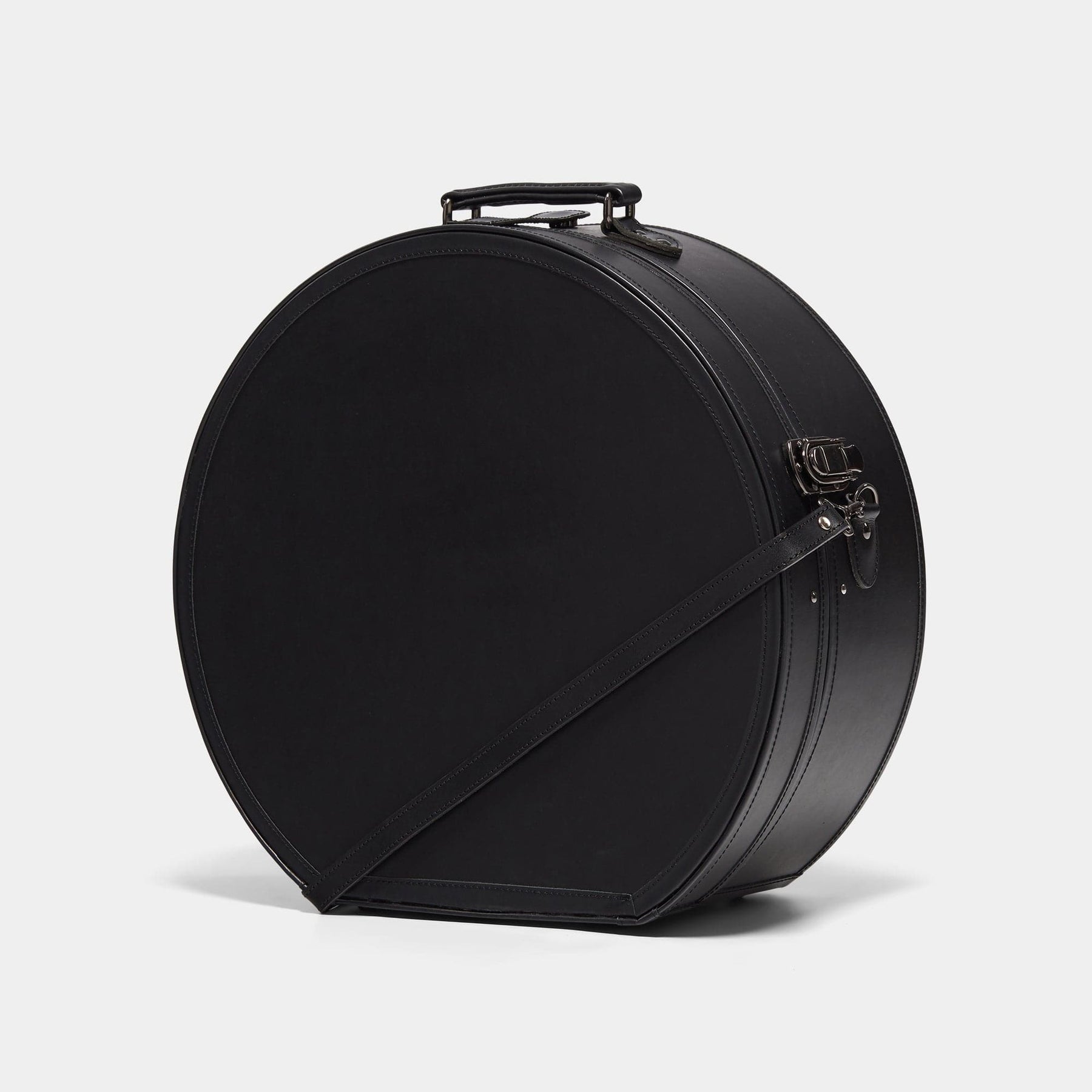 Angled product view of the deluxe hatbox Industrialist fibreboard suitcase in  black