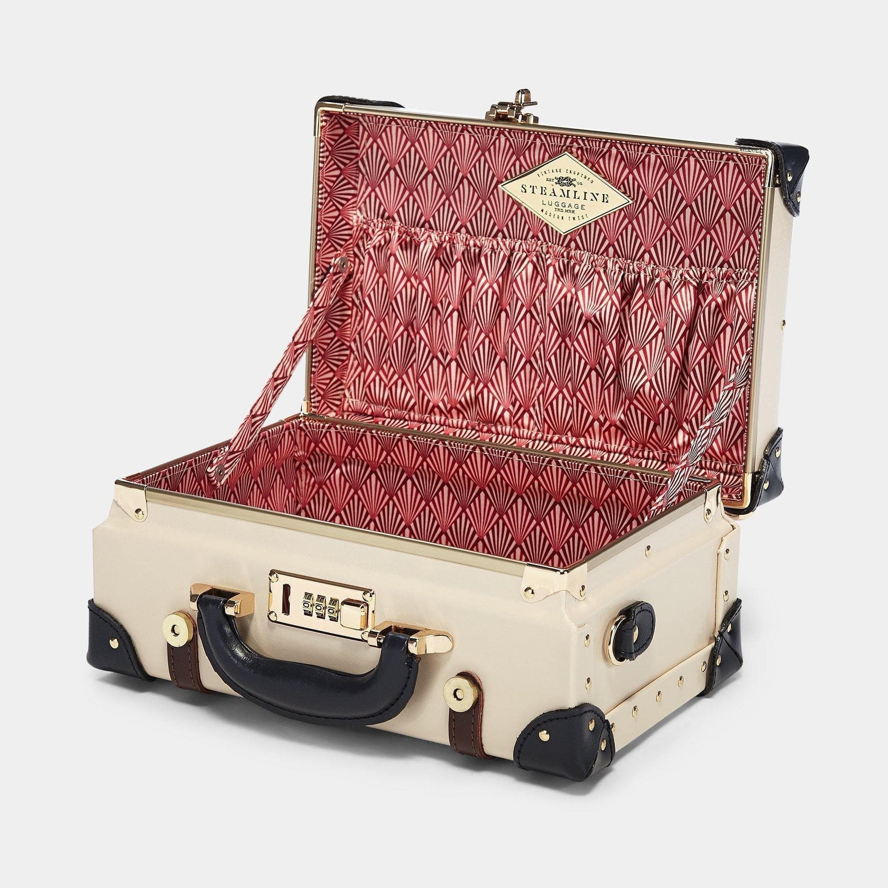 Open product view of the vanity Architect leather suitcase in cream with art-deco printed lining