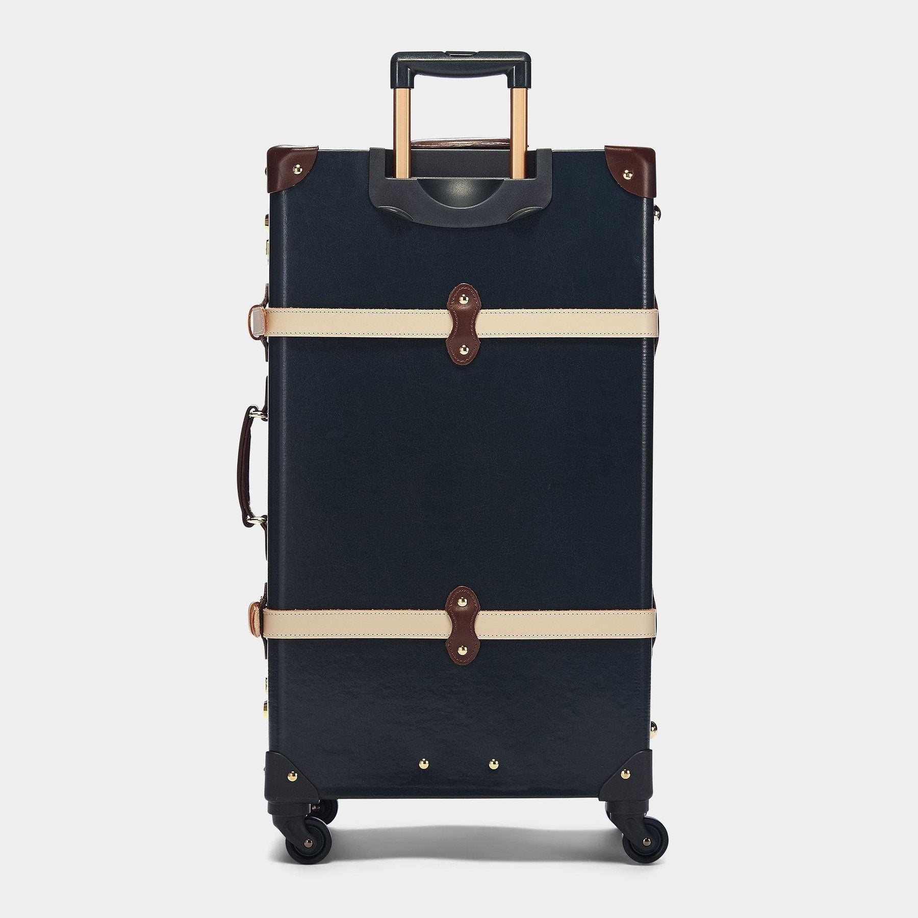 Back product view of the check-in Architect leather suitcase in navy with raised handle