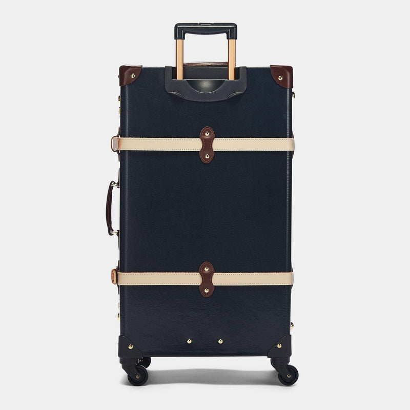 Back product view of the check-in Architect leather suitcase in navy with raised handle