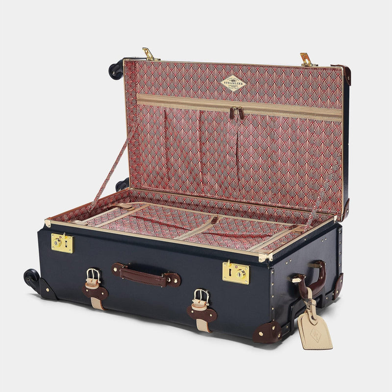 Open product view of the check-in Architect leather suitcase in navy with art-deco printed lining and cream leather luggage tag