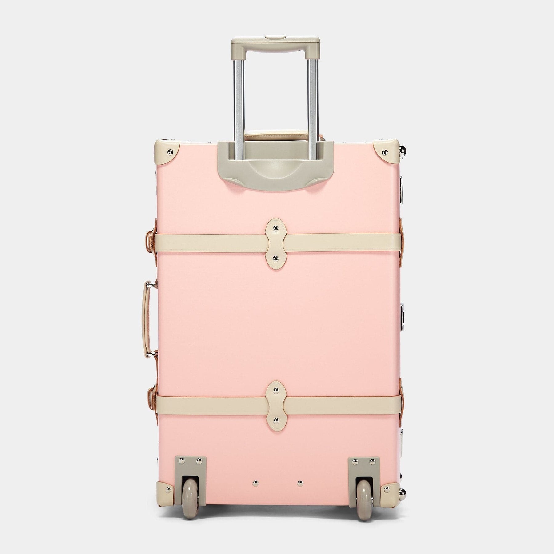 Back product view of the stowaway Botanist fibreboard suitcase in pink with raised handle