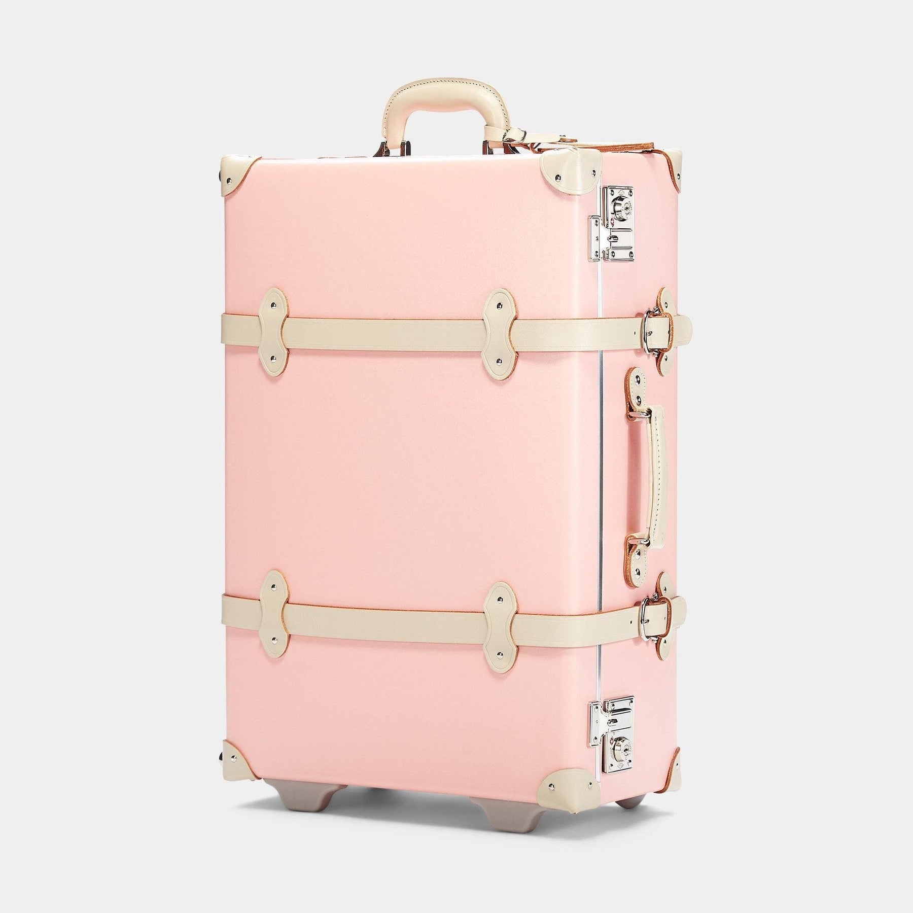 Angled product view of the stowaway Botanist fibreboard suitcase in pink