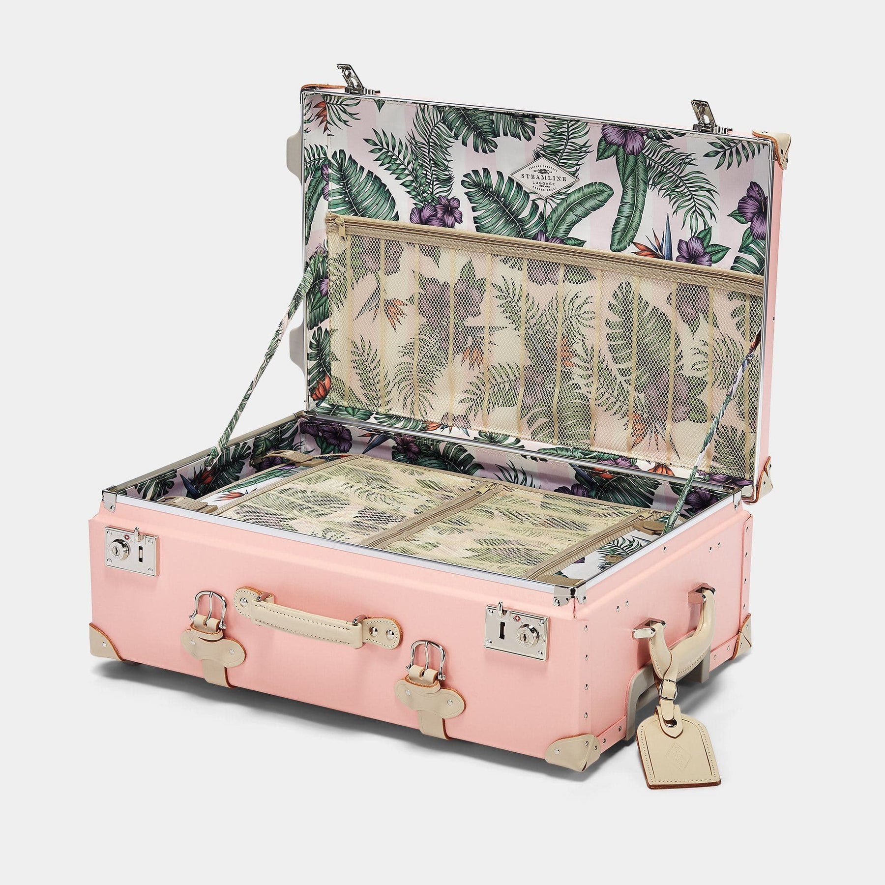 Open product view of the stowaway Botanist fibreboard suitcase in pink with palm and flower printed lining