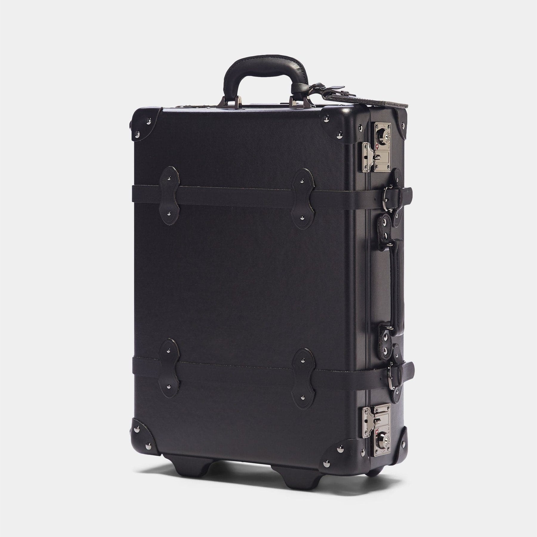 Angled product view of the carry-on Industrialist fibreboard suitcase in  black