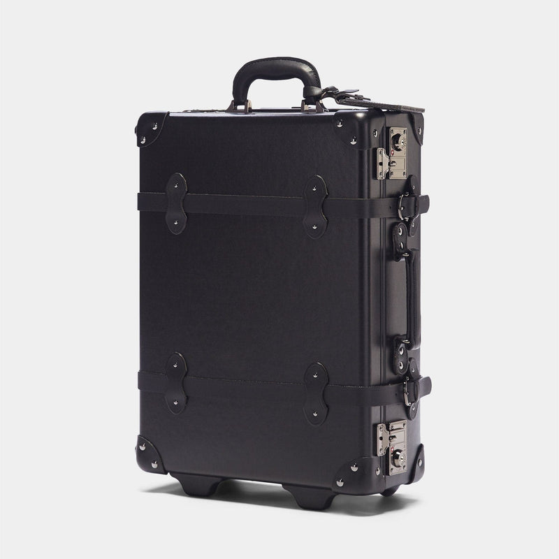 Angled product view of the carry-on Industrialist fibreboard suitcase in  black