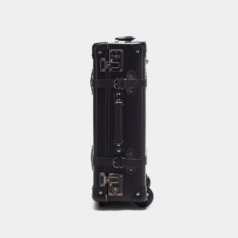 Side product view of the carry-on Industrialist fibreboard suitcase in black