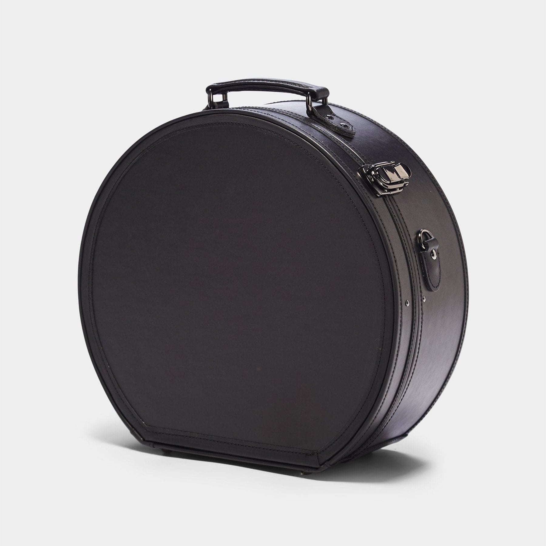 Angled product view of the large hatbox Industrialist fibreboard suitcase in  black