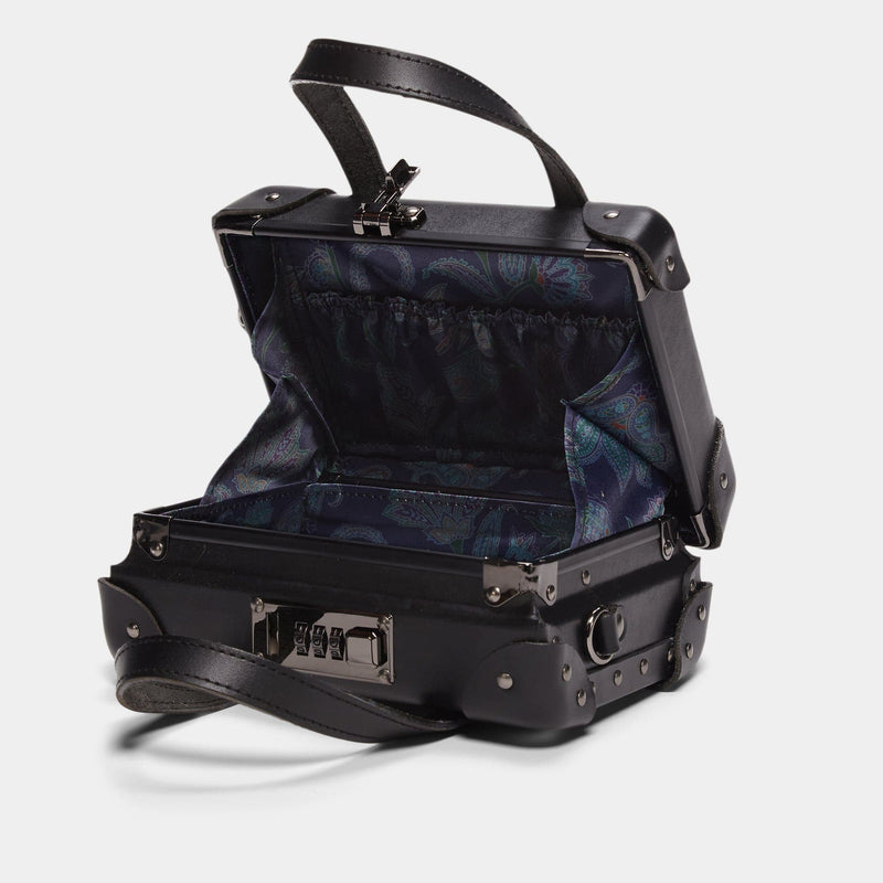 Open product view of the mini Industrialist fibreboard suitcase in black with navy paisley print lining