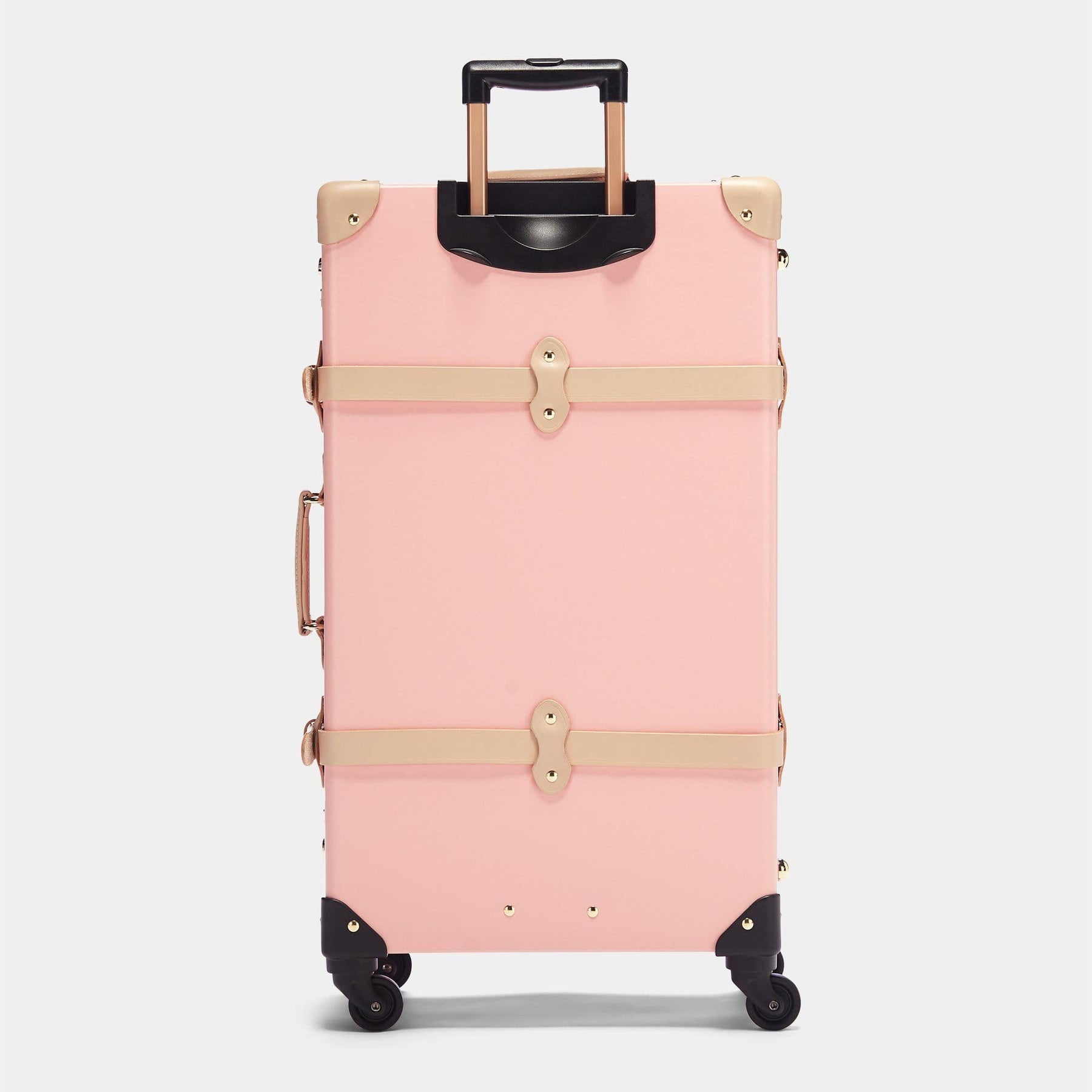 Back product view of the check-in Correspondent fibreboard suitcase in pink with raised handle