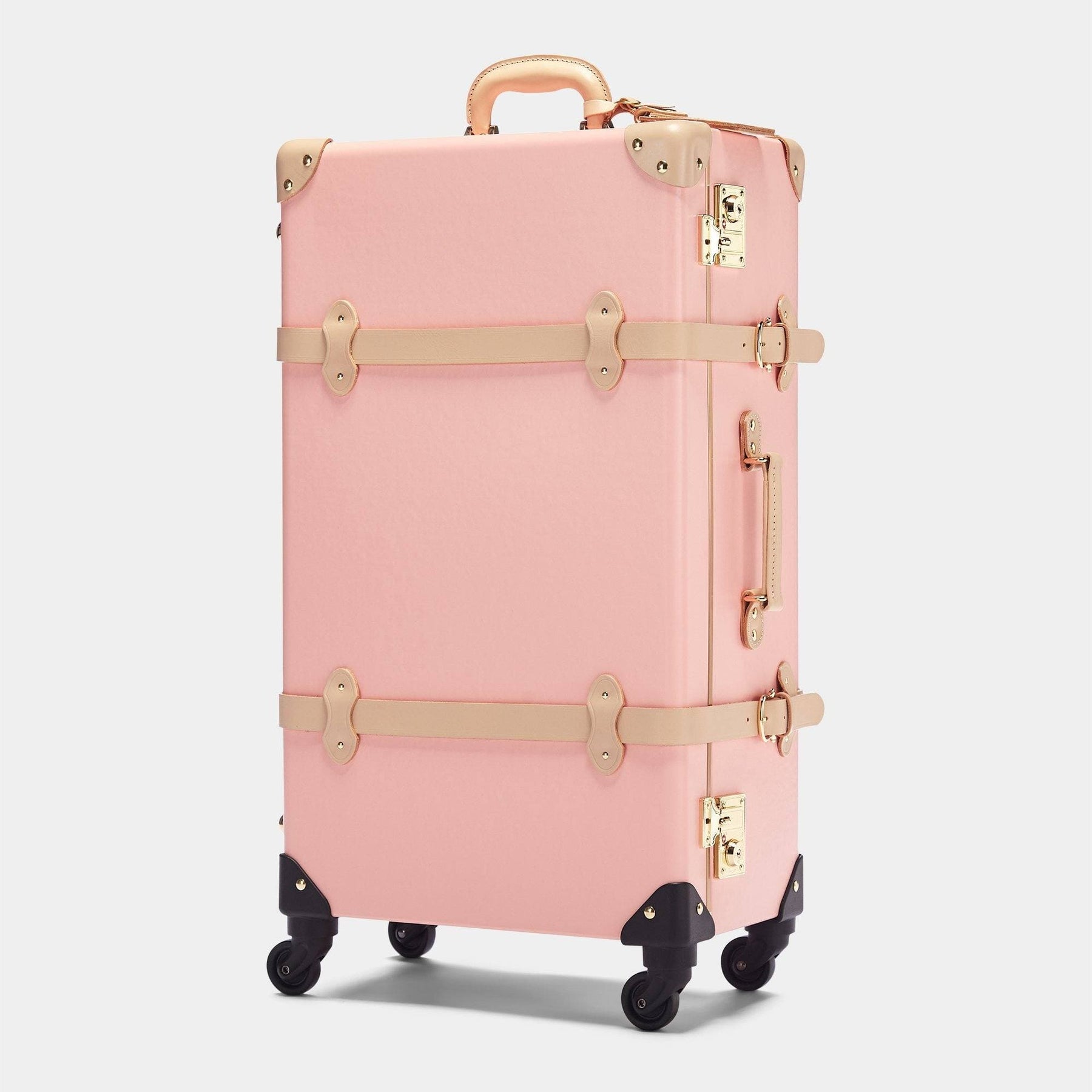 Angled product view of the check-in Correspondent fibreboard suitcase in pink