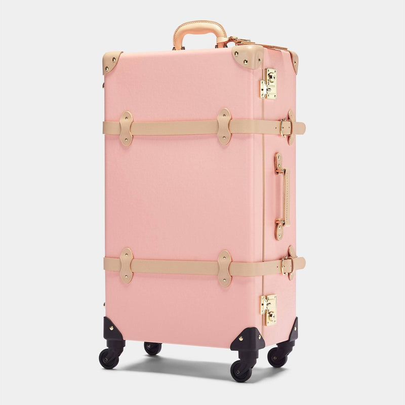 Angled product view of the check-in Correspondent fibreboard suitcase in pink