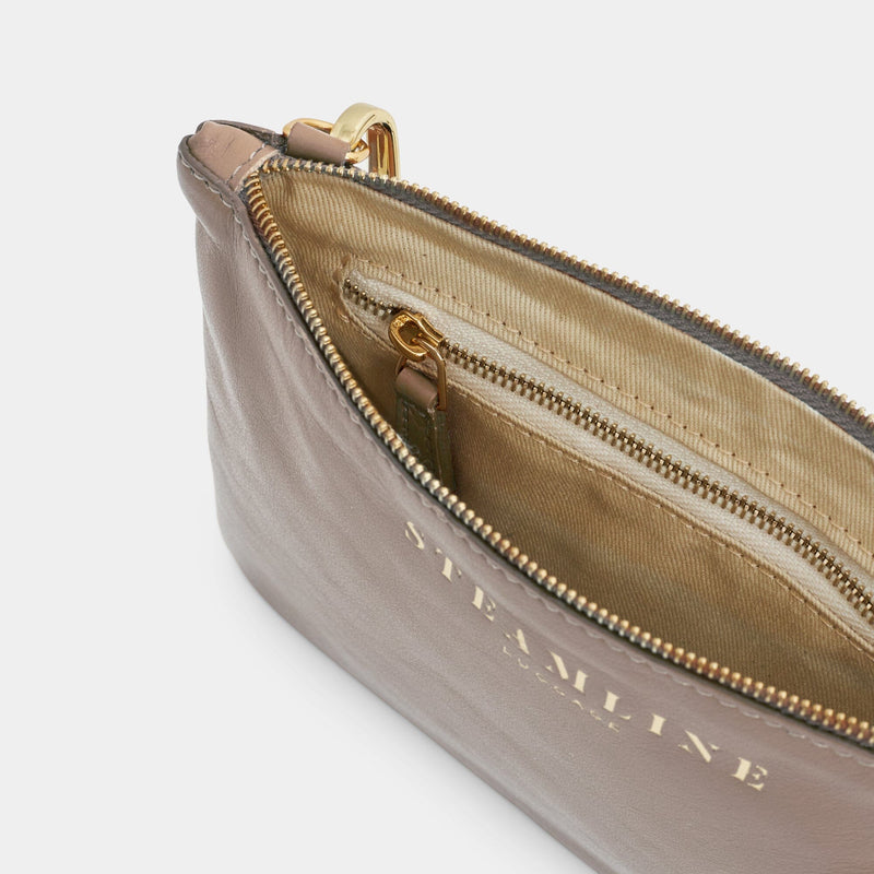 Open product view of the Navigator leather crossbody in stone with gold trims and ecru lining