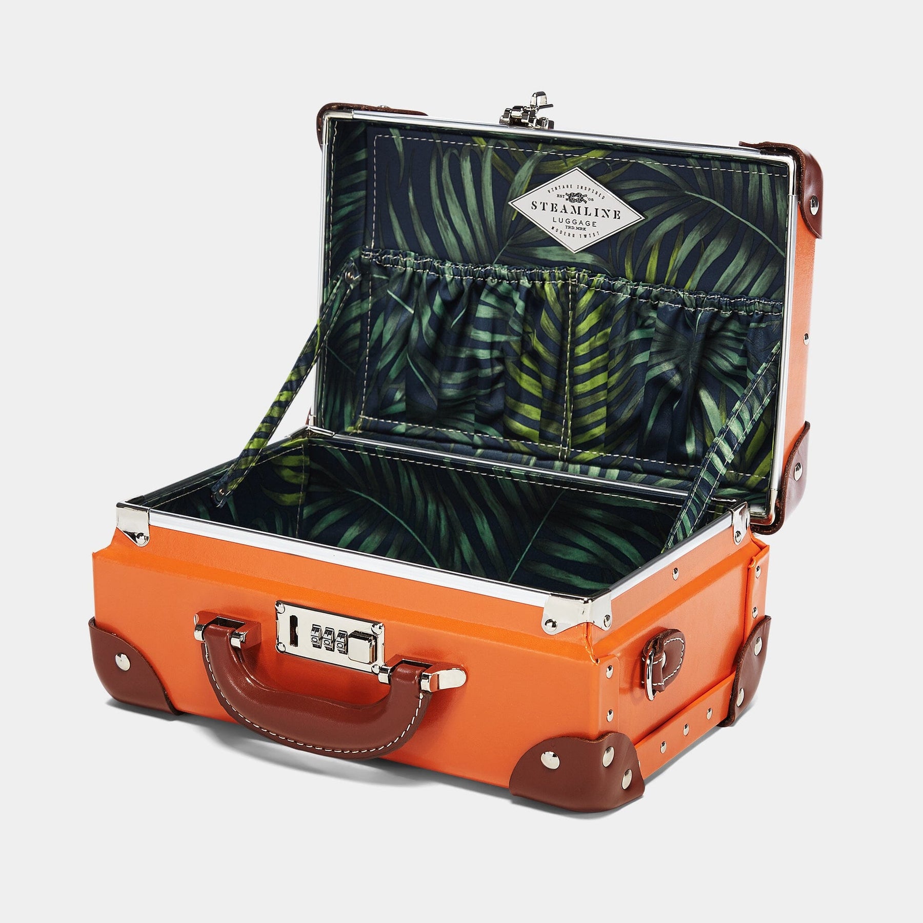 Open product view of the vanity Anthropologist leather suitcase in orange with green palms print lining