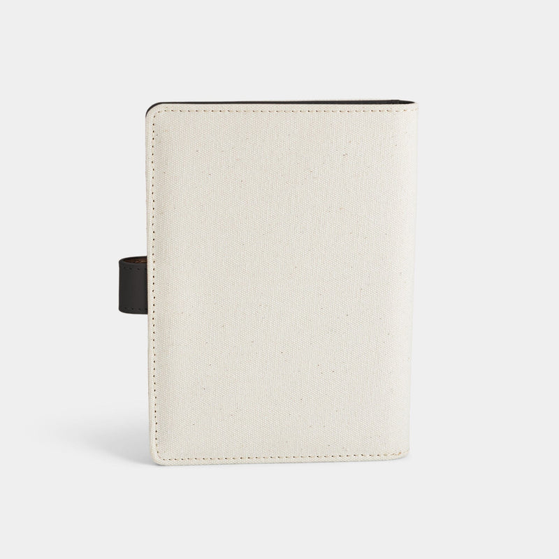 Back product view of the Navigator leather passport holder in white with black trim