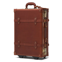 Angled product view of the stowaway Pioneer leather suitcase in brown