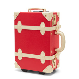 Angled product view of the kids carry-on Entrepreneur vegan leather suitcase in lipstick red