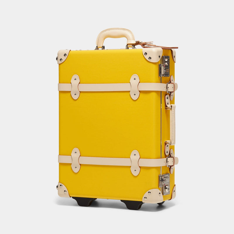 Angled product view of the carry-on Correspondent fibreboard suitcase in canary yellow