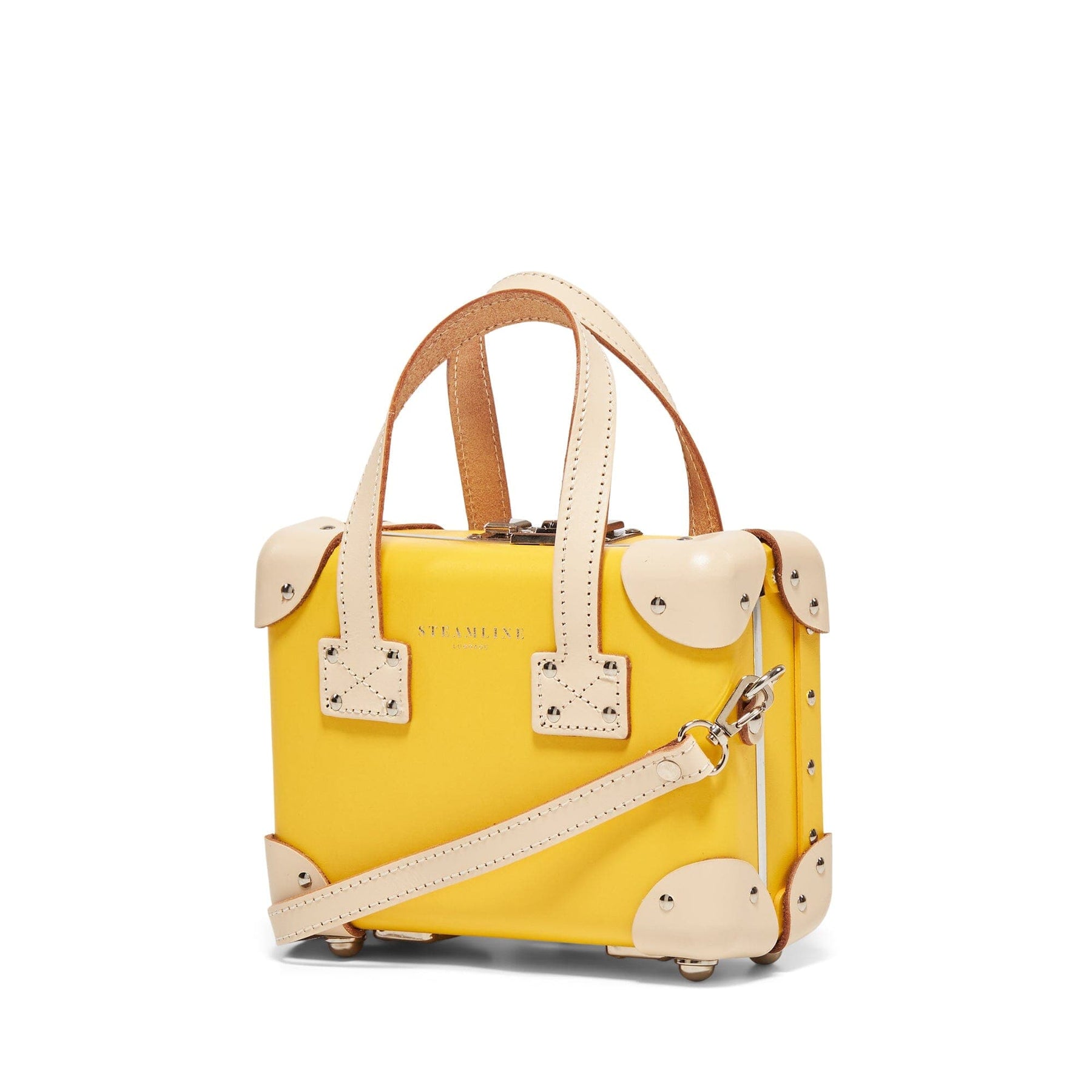 Angled product view of the mini Correspondent fibreboard suitcase in yellow with shoulder attachment strap