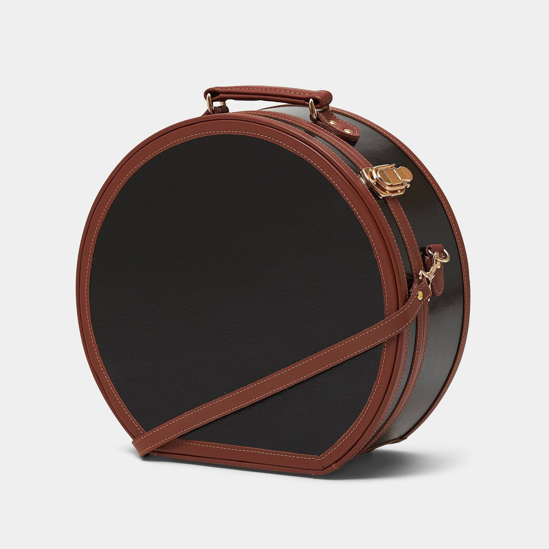 Angled product view of the large hatbox Diplomat leather suitcase in black with shoulder attachment strap