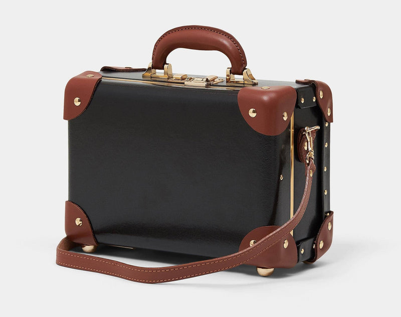 Angled product view of the vanity Diplomat leather suitcase in black with shoulder attachment strap