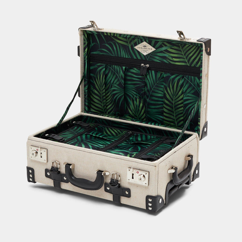 Open product view of the carry-on Editor linen suitcase with black trims and palm leaf print lining