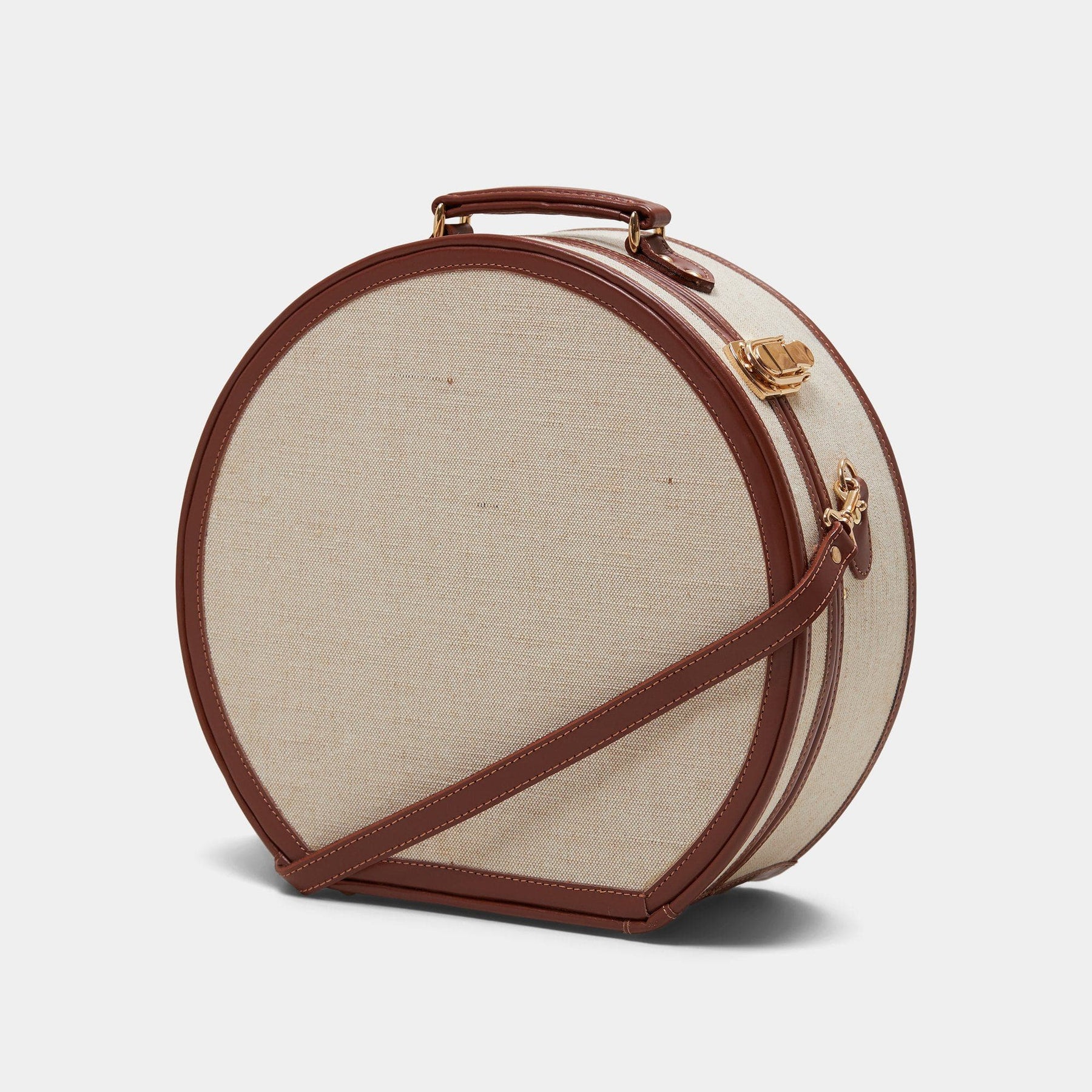 Angled product view of the large hatbox Editor linen suitcase with brown trims 