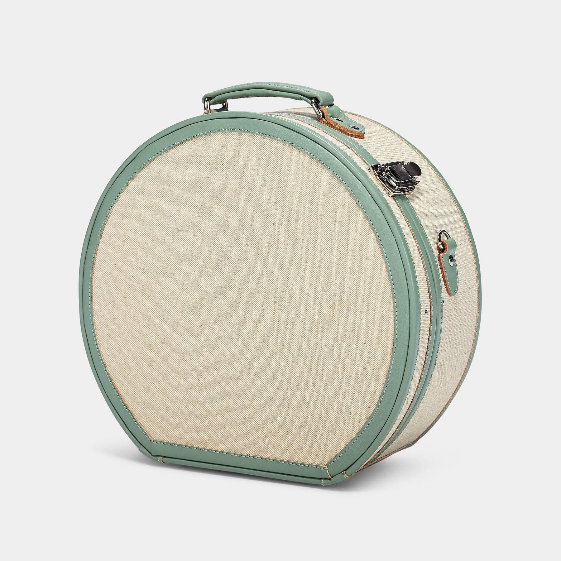 Angled product view of the large hatbox Editor linen suitcase with sea green trims