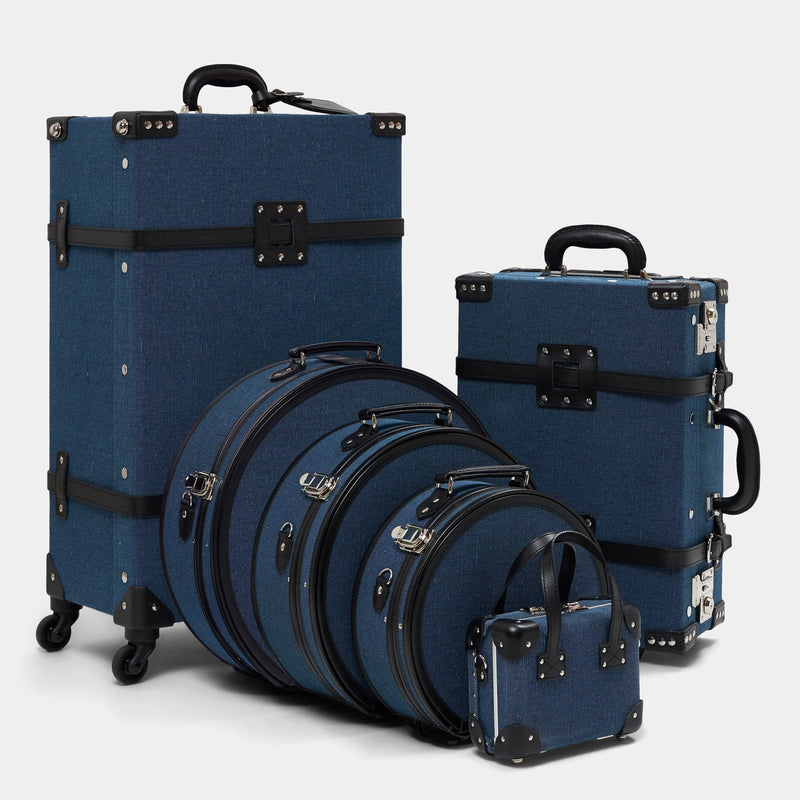 Designer luggage set of The Editor linen suitcase with navy body and black trims