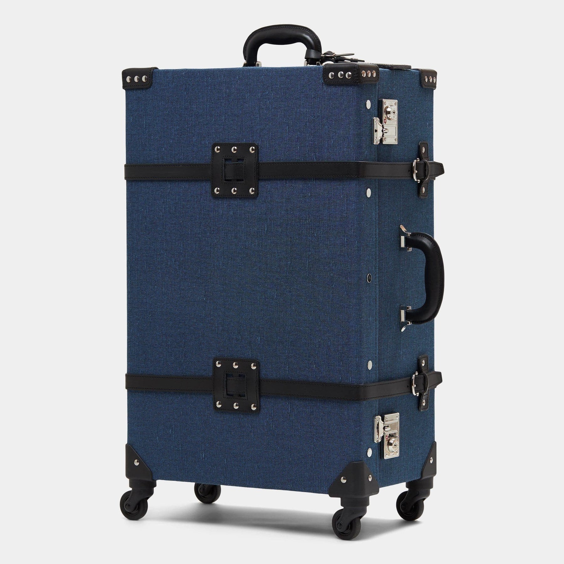 Angled product view of the check-in spinner Editor linen suitcase with navy body and black trims