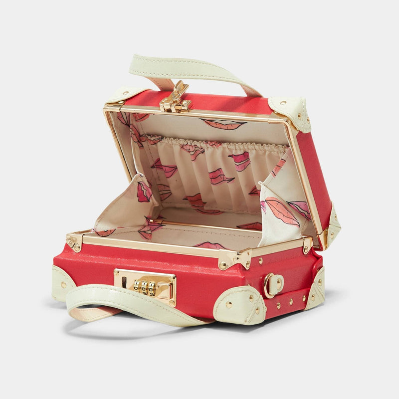 Open product view of the mini Entrepreneur vegan leather suitcase in lipstick red with lip print lining