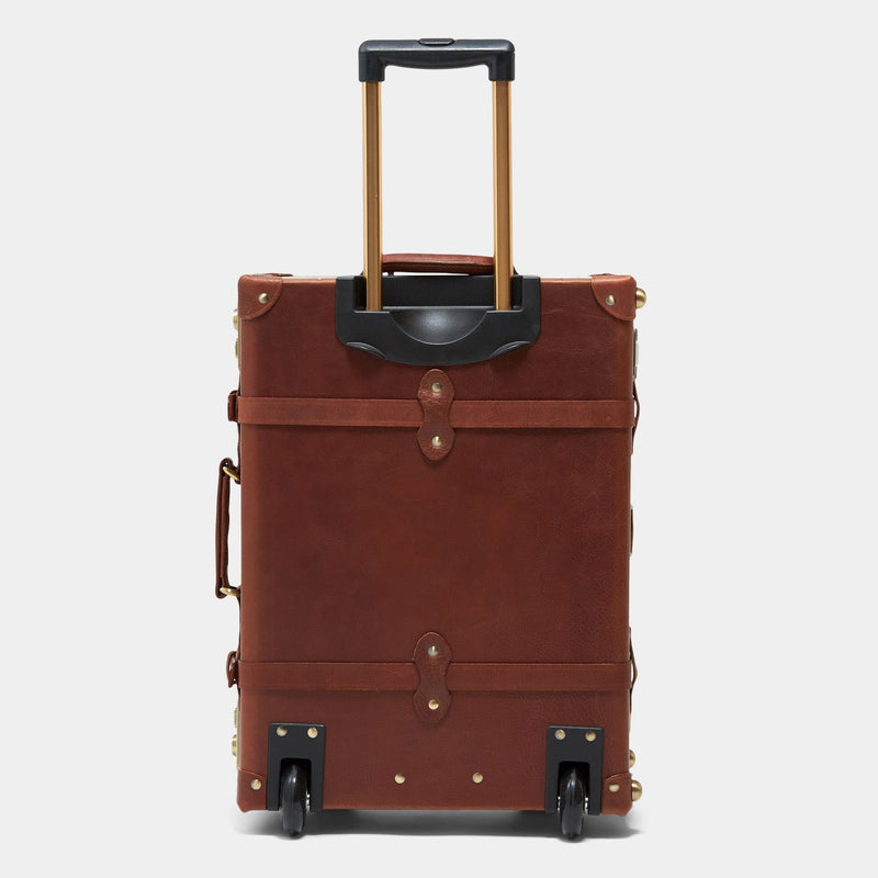 Back product view of the stowaway Pioneer leather suitcase in brown with raised handle