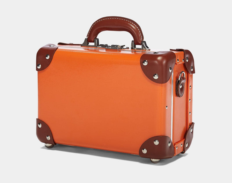 Angled product view of the vanity Anthropologist leather suitcase in orange