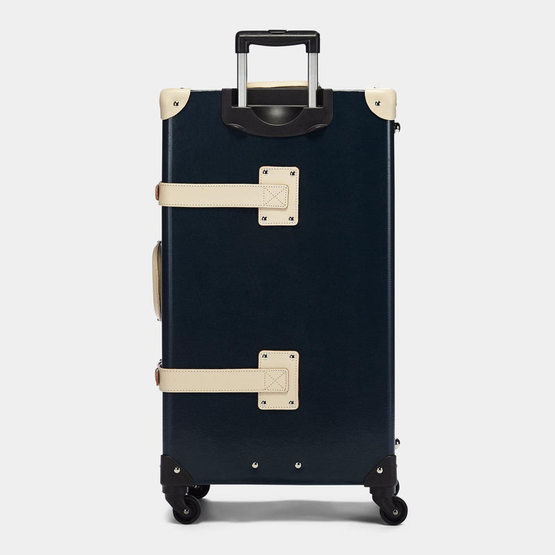 Back product view of the check-in Anthropologist leather suitcase in navy with raised handle
