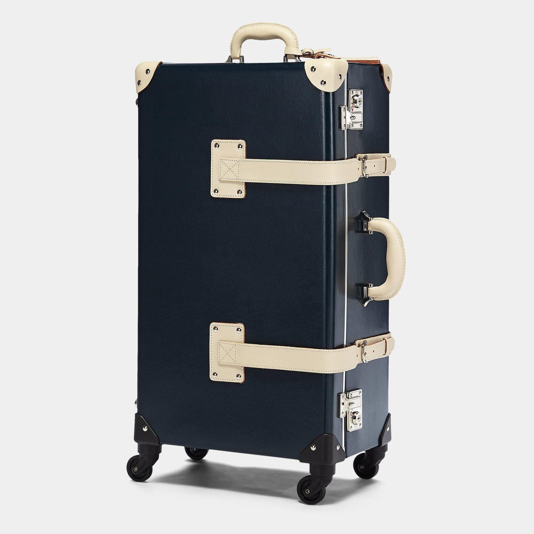 Angled product view of the check-in spinner Anthropologist leather suitcase in navy