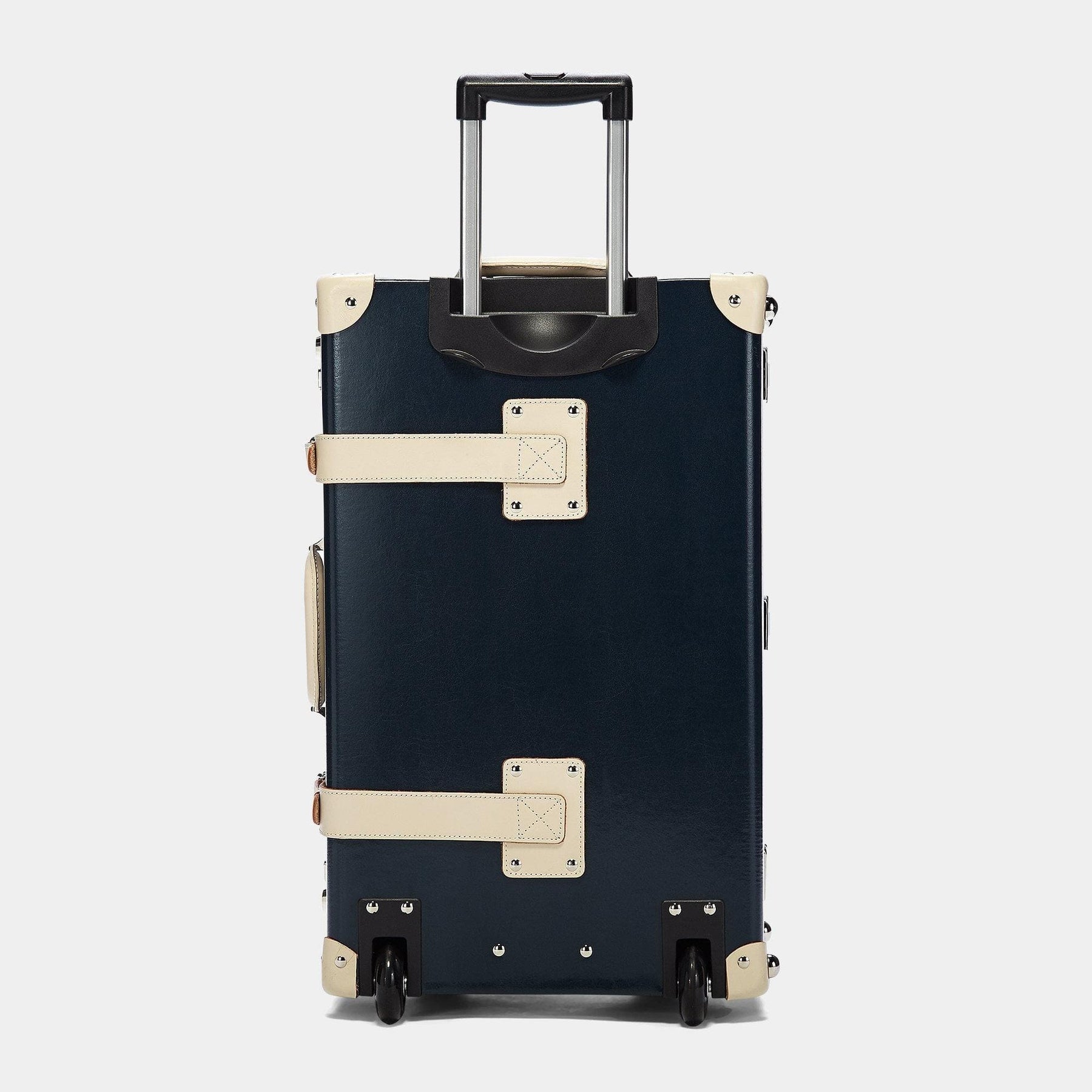 Back product view of the stowaway Anthropologist leather suitcase in navy with raised handle