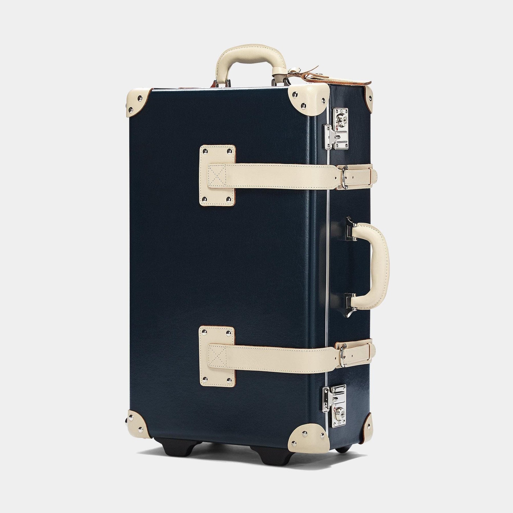 Angled product view of the stowaway Anthropologist leather suitcase in navy