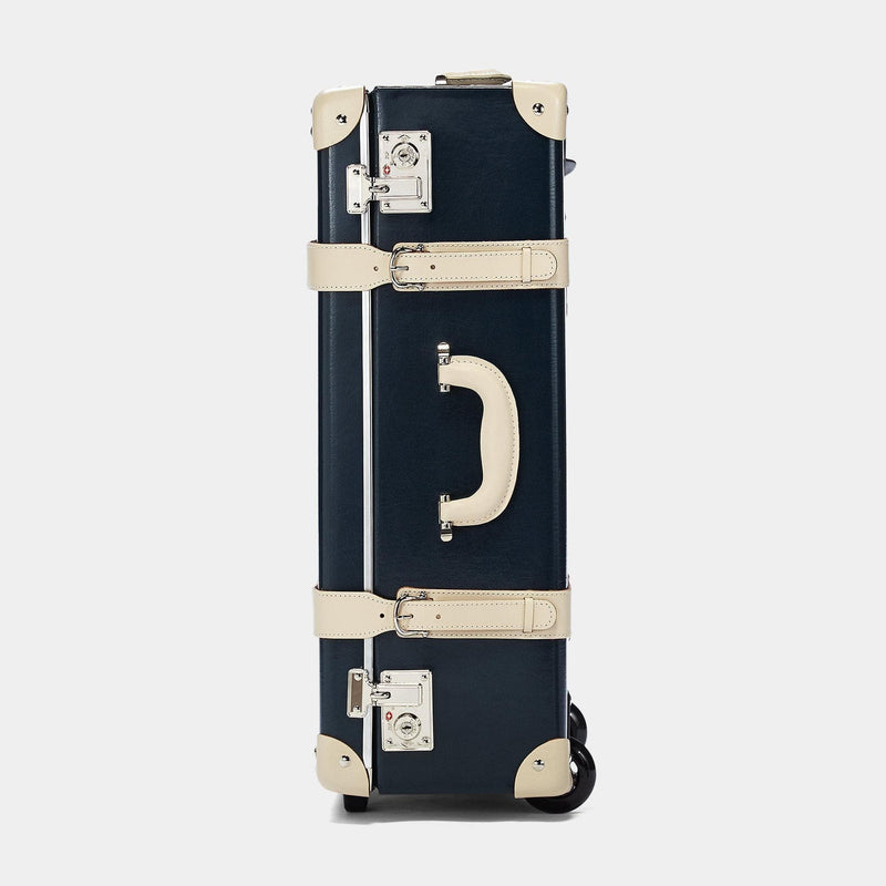 Side product view of the stowaway Anthropologist leather suitcase in navy