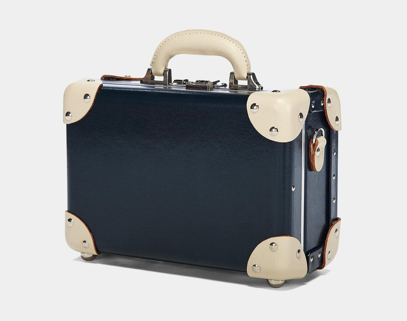 Angled product view of the vanity Anthropologist leather suitcase in navy