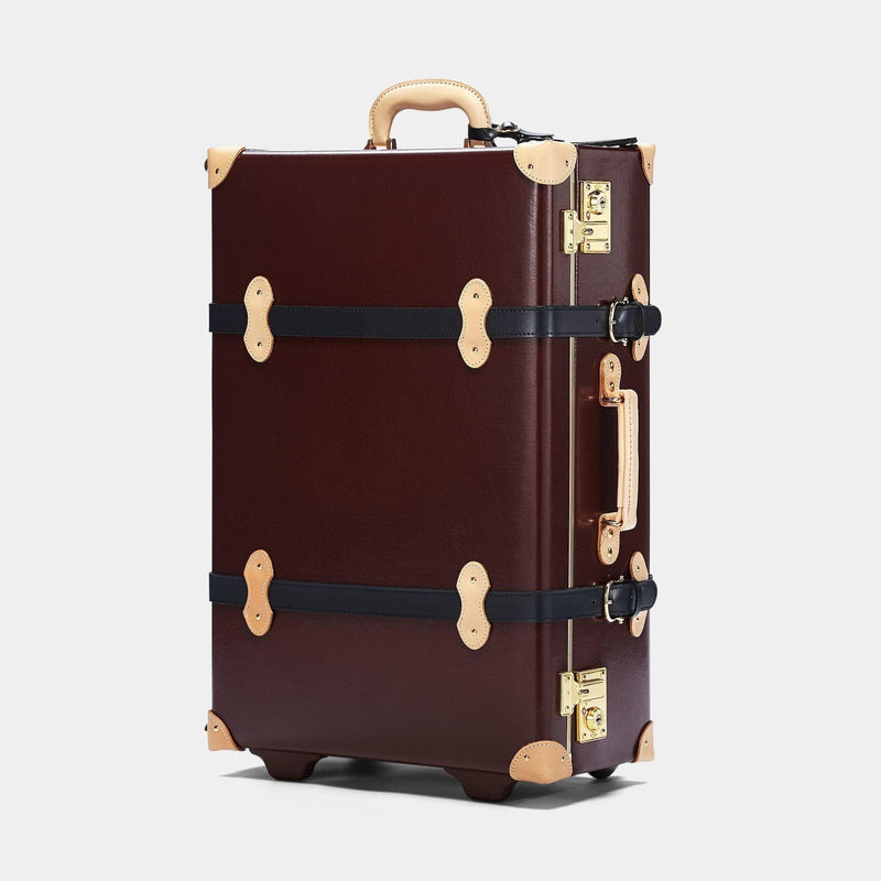 Angled product view of the stowaway Architect leather suitcase in burgundy