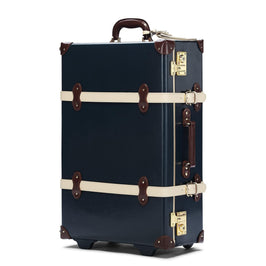 Angled product view of the stowaway Architect leather suitcase in navy