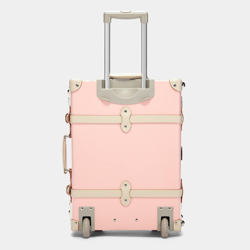 Back product view of the carry-on Botanist fibreboard suitcase in pink with raised handle