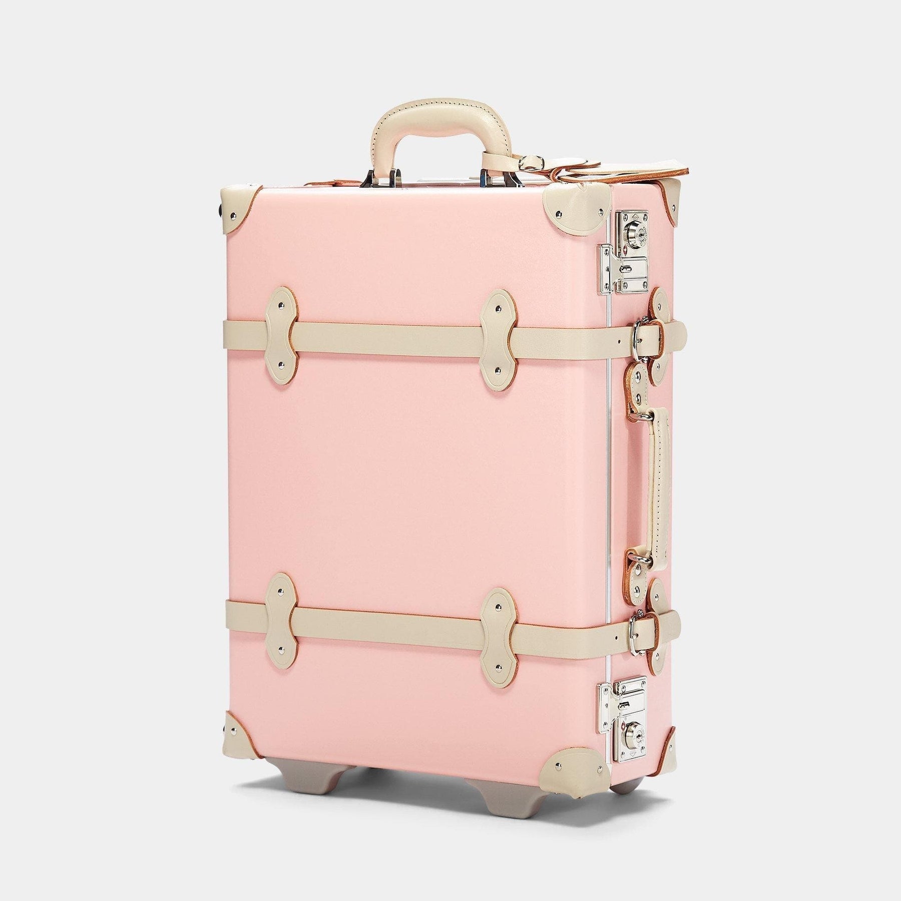 Angled product view of the carry-on Botanist fibreboard suitcase in pink