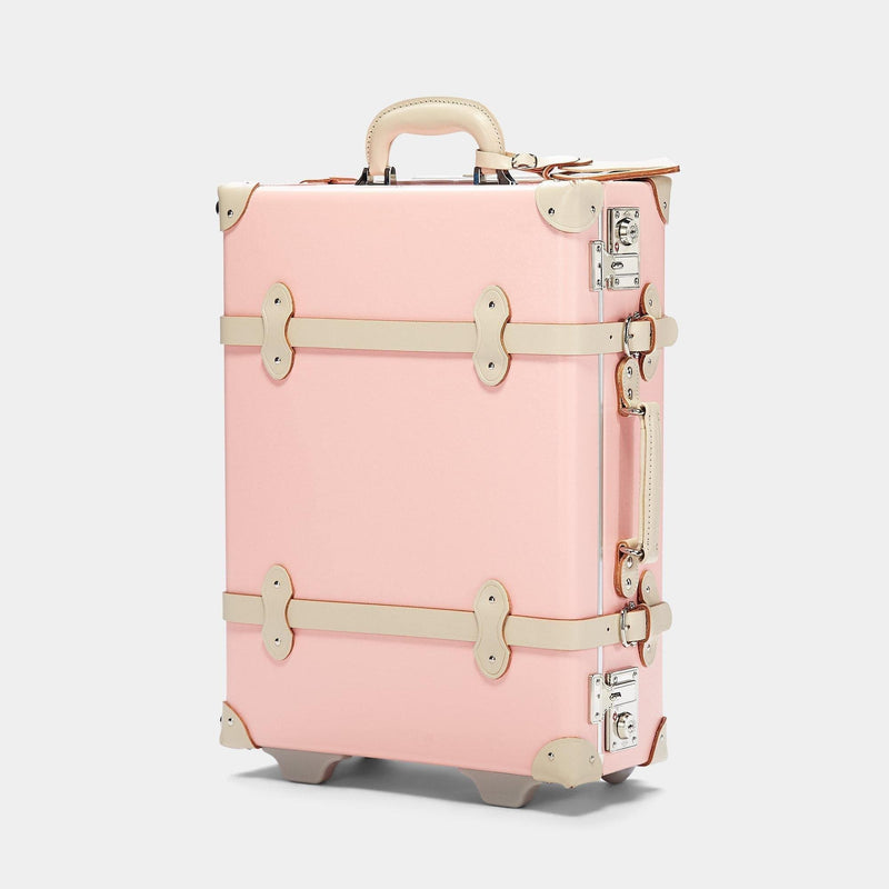 Angled product view of the carry-on Botanist fibreboard suitcase in pink