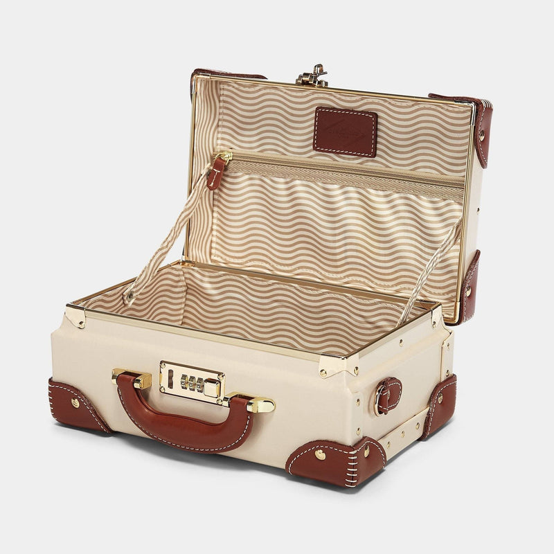 Open product view of the vanity Diplomat leather suitcase in cream with snaffle-bit printed lining