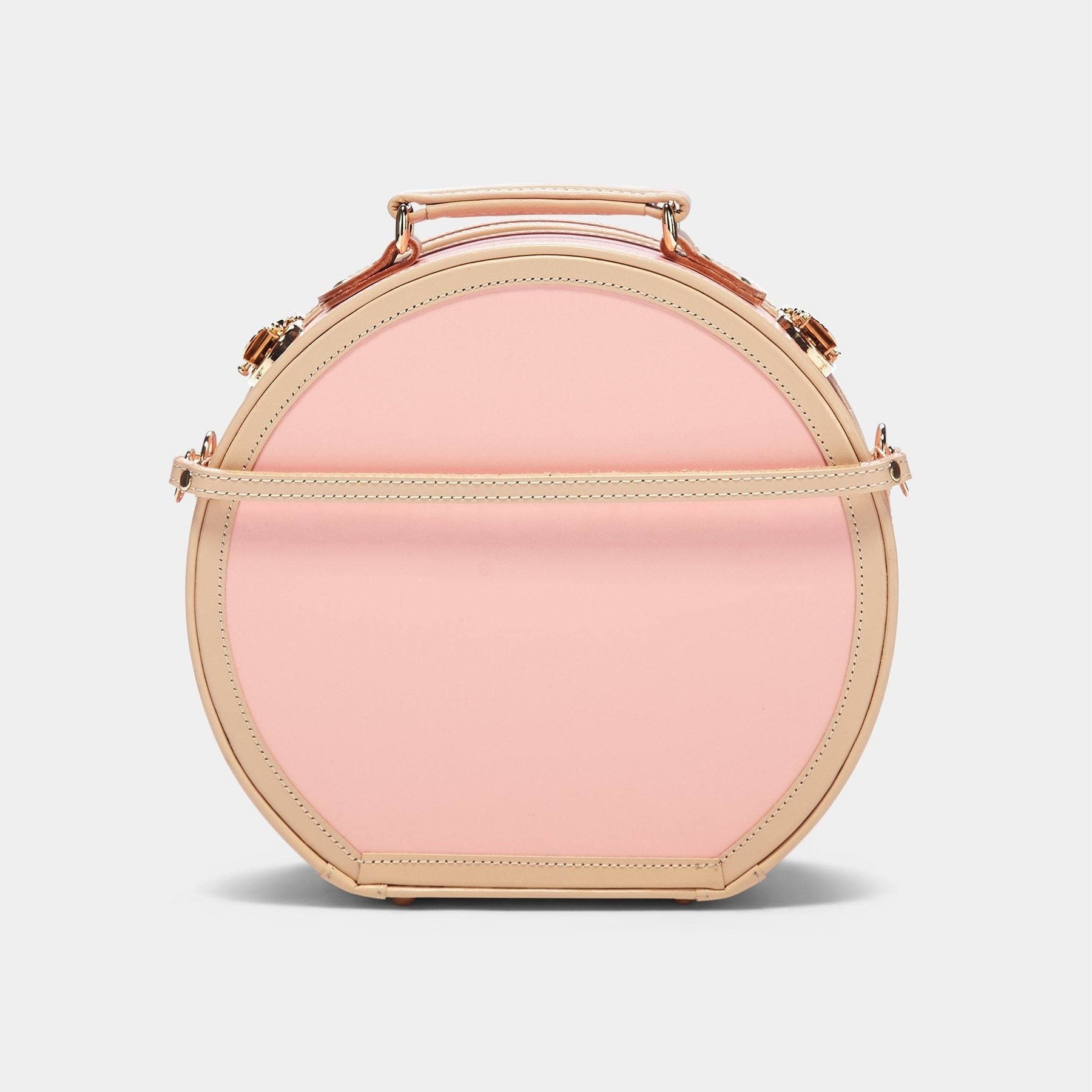 Product view of the small hatbox Correspondent fibreboard suitcase in pink with detachable suitcase strap