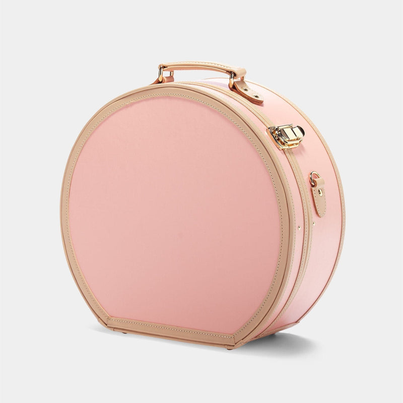 Angled product view of the large hatbox Correspondent fibreboard suitcase in pink