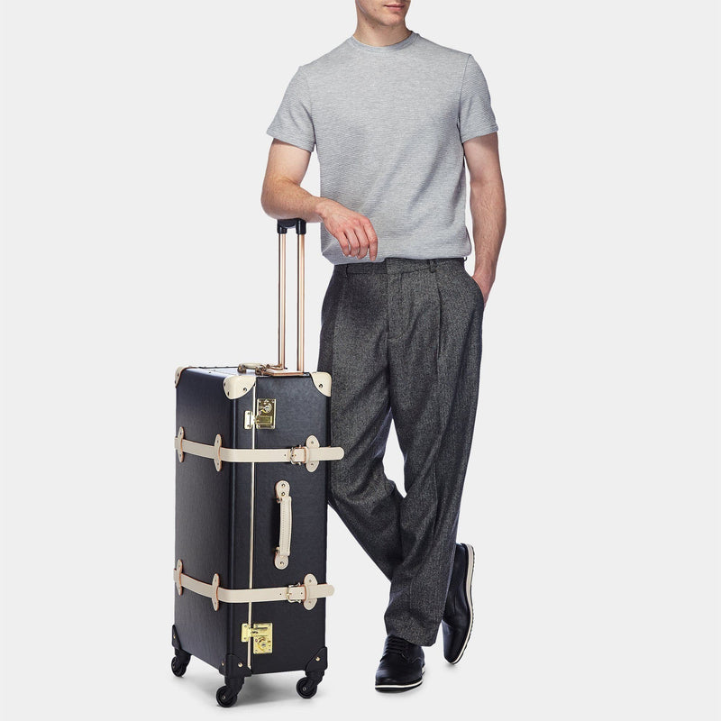 Male model with the check-in spinner Starlet fibreboard suitcase in black 
